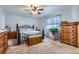 Inviting bedroom featuring classic furniture, soft carpet, and ample natural light from the window at 433 N 15Th Ave, Brighton, CO 80601