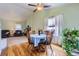 Hardwood floors and large window offer a charming dining space at 433 N 15Th Ave, Brighton, CO 80601