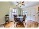 Bright dining area with hardwood floors and a ceiling fan at 433 N 15Th Ave, Brighton, CO 80601