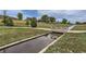 Scenic view of community park featuring a small bridge over the water at 433 N 15Th Ave, Brighton, CO 80601