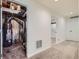 Hallway with a water heater and an entrance to the bathroom with a shower at 433 N 15Th Ave, Brighton, CO 80601