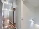 Bright hallway featuring hardwood floors and neutral walls, seamlessly connecting different areas of the home at 433 N 15Th Ave, Brighton, CO 80601