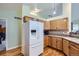 Well-lit kitchen with wood cabinets, stainless steel appliances, and a convenient layout, perfect for cooking at 433 N 15Th Ave, Brighton, CO 80601
