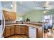 Open kitchen with granite countertops, double sink, and stainless steel dishwasher; ideal for Gathering gatherings at 433 N 15Th Ave, Brighton, CO 80601