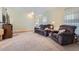 Cozy living room with plush carpeting and comfortable seating at 433 N 15Th Ave, Brighton, CO 80601