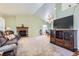 Spacious living area with a brick fireplace, large windows, and open layout at 433 N 15Th Ave, Brighton, CO 80601