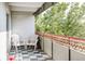 Relaxing balcony featuring checkered floors and a beautiful red railing, perfect for enjoying the outdoors at 1441 N Humboldt St # 302, Denver, CO 80218