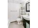 The renovated bathroom features a sleek vanity and tiled shower at 1441 N Humboldt St # 302, Denver, CO 80218