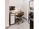 This home office setup has a sleek desk, chair and floor mirror at 1441 N Humboldt St # 302, Denver, CO 80218