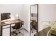 Modern home office setup with sleek desk, comfortable chair and floor mirror at 1441 N Humboldt St # 302, Denver, CO 80218