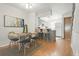 Open floor plan dining area features stylish decor, eat in breakfast bar, and plenty of natural light at 1699 S Trenton St # 147, Denver, CO 80231