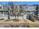 Charming townhome with eye-catching curb appeal, private garages, and inviting entryways at 1699 S Trenton St # 147, Denver, CO 80231