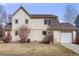 Exterior view of a home with a well-maintained lawn at 1334 Carriage Dr, Longmont, CO 80501