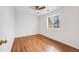 Bedroom featuring laminate wood flooring, a ceiling fan, and a window providing ample natural light at 1334 Carriage Dr, Longmont, CO 80501