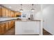 Bright kitchen with stainless steel appliances, a breakfast bar and light wood cabinets at 1334 Carriage Dr, Longmont, CO 80501