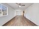 Bright and spacious living room with new hardwood floors and neutral walls at 1334 Carriage Dr, Longmont, CO 80501