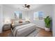 Nicely staged main bedroom featuring laminate wood flooring, neutral decor, and plenty of natural light at 1334 Carriage Dr, Longmont, CO 80501