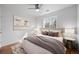 Nicely staged main bedroom featuring laminate wood flooring, neutral decor, and plenty of natural light at 1334 Carriage Dr, Longmont, CO 80501