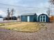 View of backyard and detached sheds with well-maintained grass at 4901 Bryant St, Denver, CO 80221