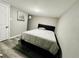 Cozy bedroom showcases a comfortable bed, complemented by neutral decor and a peaceful ambiance at 4901 Bryant St, Denver, CO 80221