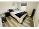 Inviting bedroom with soft, natural light, featuring a cozy bed and modern amenities, ideal for relaxation at 4901 Bryant St, Denver, CO 80221