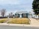 Charming single-Gathering home with a well-maintained lawn and a one-car garage at 4901 Bryant St, Denver, CO 80221