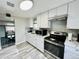 Modern kitchen featuring white cabinets, new appliances, and stainless steel appliances at 4901 Bryant St, Denver, CO 80221