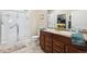 Modern bathroom with dual sinks, walk-in shower, and sleek fixtures at 12564 Madison Way, Thornton, CO 80241