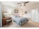 Inviting bedroom featuring a queen bed, vintage dresser, and neutral tones at 12564 Madison Way, Thornton, CO 80241