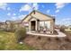 Inviting single-story home showcasing stone details, a covered front porch, and neat landscaping at 12564 Madison Way, Thornton, CO 80241