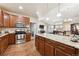 Open kitchen with granite countertops, stainless steel appliances, and a view into the living area at 12564 Madison Way, Thornton, CO 80241