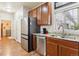 Modern kitchen with stainless steel appliances, granite countertops, and updated cabinetry at 12564 Madison Way, Thornton, CO 80241
