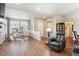 Comfortable living room with hardwood floors and a seating area near the front entry at 12564 Madison Way, Thornton, CO 80241