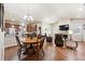 Bright and open living space with hardwood floors, a cozy fireplace, and lots of natural light at 12564 Madison Way, Thornton, CO 80241