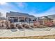 Community pool enclosed by a black fence, offering a private and secure space for residents to relax and enjoy the outdoors at 12564 Madison Way, Thornton, CO 80241