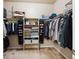 Well-organized walk-in closet with shelving, hanging rods, and ample storage space at 12564 Madison Way, Thornton, CO 80241