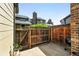 Enclosed backyard patio with privacy fence, perfect for outdoor grilling and relaxation at 10842 W Evans Ave # 34, Lakewood, CO 80227