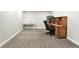 Basement featuring carpet flooring, a desk, and a safe at 10842 W Evans Ave # 34, Lakewood, CO 80227