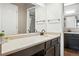 Bathroom featuring a vanity with a single sink, large mirror, and overhead lights at 10842 W Evans Ave # 34, Lakewood, CO 80227