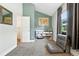 Neutral bedroom with a world map, storage shelves, and seating for quiet contemplation or relaxation at 10842 W Evans Ave # 34, Lakewood, CO 80227
