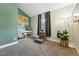 Comfortable bedroom with stylish decor, cozy carpet, and natural light at 10842 W Evans Ave # 34, Lakewood, CO 80227
