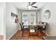 Cozy dining area with a marble table, seating for four, and a modern ceiling fan at 10842 W Evans Ave # 34, Lakewood, CO 80227