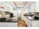 Bright kitchen featuring modern appliances, neutral backsplash, and ample counter space at 10842 W Evans Ave # 34, Lakewood, CO 80227