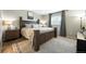 Comfortable main bedroom featuring a large bed, neutral tones, and soft natural light from the window at 10842 W Evans Ave # 34, Lakewood, CO 80227