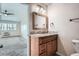 Bathroom vanity with granite countertop, wood cabinets, and stylish fixtures at 9655 E Center Ave # 11D, Denver, CO 80247