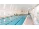 Bright indoor swimming pool with abundant natural light and windows at 9655 E Center Ave # 11D, Denver, CO 80247