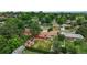 Aerial view of the property highlighting the backyard, landscaping, and its location within a residential neighborhood at 1705 Lewis St, Lakewood, CO 80215