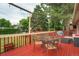 Spacious deck with dining table, seating, and a backyard view at 1705 Lewis St, Lakewood, CO 80215