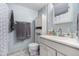 Bathroom featuring a sink, a toilet and hanging towels on the wall at 1705 Lewis St, Lakewood, CO 80215