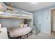bedroom features a bunk bed with storage and cozy decor at 1705 Lewis St, Lakewood, CO 80215